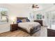 Bright bedroom with wood flooring and a king-size bed at 18520 Oak Way Dr, Hudson, FL 34667
