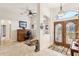 Inviting entryway with wood double doors, tile flooring and home office at 18520 Oak Way Dr, Hudson, FL 34667