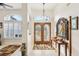 Spacious entryway with double doors and a decorative console table at 18520 Oak Way Dr, Hudson, FL 34667