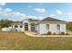 One-story house with double doors and a landscaped yard at 18520 Oak Way Dr, Hudson, FL 34667