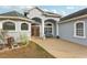 Two-story house with double doors and walkway at 18520 Oak Way Dr, Hudson, FL 34667