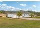 Single-story home with two palm trees at 18520 Oak Way Dr, Hudson, FL 34667