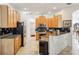 Kitchen with light wood cabinets, granite counters, and stainless steel appliances at 18520 Oak Way Dr, Hudson, FL 34667