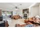 Living area with fireplace, leather sofas and pool access at 18520 Oak Way Dr, Hudson, FL 34667