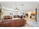 Spacious living room with open floor plan and large TV at 18520 Oak Way Dr, Hudson, FL 34667