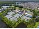 Aerial view of community tennis courts, pool, and clubhouse at 18732 Wimbledon Cir, Lutz, FL 33558