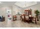 Bright dining area with a view to the kitchen at 18732 Wimbledon Cir, Lutz, FL 33558