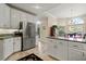 Well-appointed kitchen featuring granite counters, stainless steel appliances, and ample cabinet space at 18732 Wimbledon Cir, Lutz, FL 33558