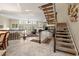 Elegant staircase with a view to the living room and dining area at 18732 Wimbledon Cir, Lutz, FL 33558