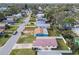 Aerial view of a teal home with a metal roof, situated on a residential street at 1885 Mississippi Ne Ave, St Petersburg, FL 33703