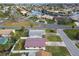Aerial view of a single-Gathering home with a metal roof, showcasing the surrounding neighborhood at 1885 Mississippi Ne Ave, St Petersburg, FL 33703