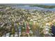 An aerial view of a house nestled in a quiet residential neighborhood near the water at 1885 Mississippi Ne Ave, St Petersburg, FL 33703