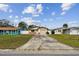 Front view of the house showing its landscaping and driveway at 1885 Mississippi Ne Ave, St Petersburg, FL 33703