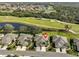 Aerial view of house and surrounding golf course community at 2019 Acadia Greens Dr # 34, Sun City Center, FL 33573