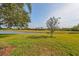 Peaceful backyard with pond and golf course views at 2019 Acadia Greens Dr # 34, Sun City Center, FL 33573