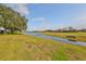 Serene backyard setting overlooking a golf course and pond at 2019 Acadia Greens Dr # 34, Sun City Center, FL 33573