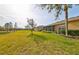 Spacious backyard with golf course views and lush landscaping at 2019 Acadia Greens Dr # 34, Sun City Center, FL 33573