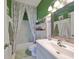 Bathroom with shower/tub combo and updated vanity at 2019 Acadia Greens Dr # 34, Sun City Center, FL 33573