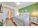 Bright bedroom with king bed and access to bathroom at 2019 Acadia Greens Dr # 34, Sun City Center, FL 33573