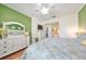 King bedroom with white dresser and ensuite bathroom access at 2019 Acadia Greens Dr # 34, Sun City Center, FL 33573