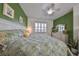 Spacious bedroom with a king-size bed and ensuite bathroom at 2019 Acadia Greens Dr # 34, Sun City Center, FL 33573