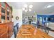 Farmhouse style dining room with wooden table and antique hutch at 2019 Acadia Greens Dr # 34, Sun City Center, FL 33573