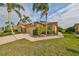 Two-story house with double garage and well manicured lawn at 2019 Acadia Greens Dr # 34, Sun City Center, FL 33573