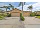 Two-story house with double garage and nicely landscaped yard at 2019 Acadia Greens Dr # 34, Sun City Center, FL 33573