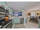 Kitchen boasts light green cabinets, stainless steel appliances, and ample counter space at 2019 Acadia Greens Dr # 34, Sun City Center, FL 33573