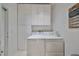 Laundry room with washer, dryer, and ample cabinet space at 2019 Acadia Greens Dr # 34, Sun City Center, FL 33573