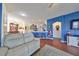 Open living room features hardwood floors, and a view of the kitchen and dining area at 2019 Acadia Greens Dr # 34, Sun City Center, FL 33573