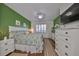 Spacious main bedroom with a king-size bed and white dresser at 2019 Acadia Greens Dr # 34, Sun City Center, FL 33573