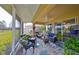Spacious screened lanai featuring comfortable seating and lush landscaping at 2019 Acadia Greens Dr # 34, Sun City Center, FL 33573