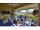 Relaxing screened porch overlooking a lush green golf course at 2019 Acadia Greens Dr # 34, Sun City Center, FL 33573