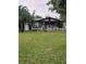 Charming single story home with a well manicured lawn and white picket fence at 225 24Th Se Ave, St Petersburg, FL 33705