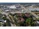 Aerial view highlighting the community's location near a shopping center and waterfront at 2650 Countryside Blvd # C309, Clearwater, FL 33761