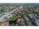 Aerial view showing community features, including pool, tennis court, and lush landscaping at 2650 Countryside Blvd # C309, Clearwater, FL 33761