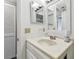 Bathroom with vanity sink and white cabinets at 2650 Countryside Blvd # C309, Clearwater, FL 33761