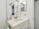 White vanity with marble countertop in updated bathroom at 2650 Countryside Blvd # C309, Clearwater, FL 33761