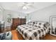 King-size bed in spacious bedroom with wood flooring at 2650 Countryside Blvd # C309, Clearwater, FL 33761