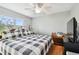 Spacious bedroom with large windows and a king-size bed at 2650 Countryside Blvd # C309, Clearwater, FL 33761