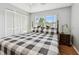 Bedroom with king-size bed, window, and closet at 2650 Countryside Blvd # C309, Clearwater, FL 33761