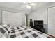 King-size bed in bright bedroom with ceiling fan at 2650 Countryside Blvd # C309, Clearwater, FL 33761