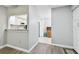 Entryway with view of kitchen and granite countertop at 2650 Countryside Blvd # C309, Clearwater, FL 33761