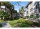 Condo building exterior showcasing landscaping and walkways at 2650 Countryside Blvd # C309, Clearwater, FL 33761