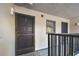 Condo hallway with dark brown door to unit 309 at 2650 Countryside Blvd # C309, Clearwater, FL 33761