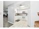 White kitchen with stainless steel appliances at 2650 Countryside Blvd # C309, Clearwater, FL 33761