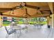 Covered patio with tables and chairs at 2650 Countryside Blvd # C309, Clearwater, FL 33761
