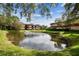 Tranquil pond view with building in background at 2650 Countryside Blvd # C309, Clearwater, FL 33761