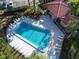 Community pool with surrounding lounge chairs at 2650 Countryside Blvd # C309, Clearwater, FL 33761
